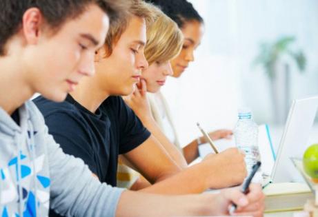 four teens studying